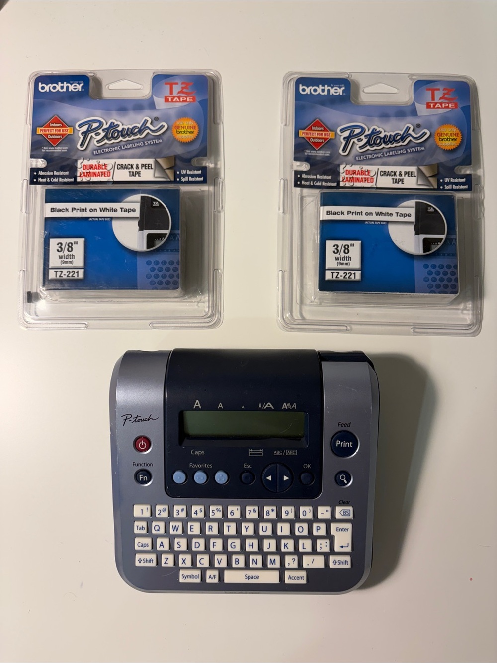 Brother P-touch Label Maker in Navy and Gray with Black-on-White TZ Tapes